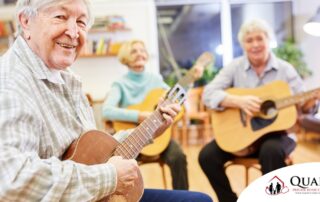 A group of seniors enjoy playing instruments together showing the impact of music for older adults.